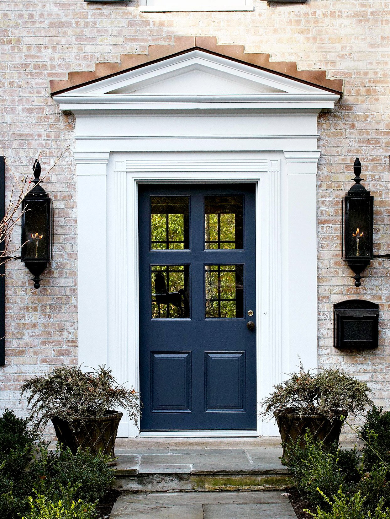 Blue front door with white trim